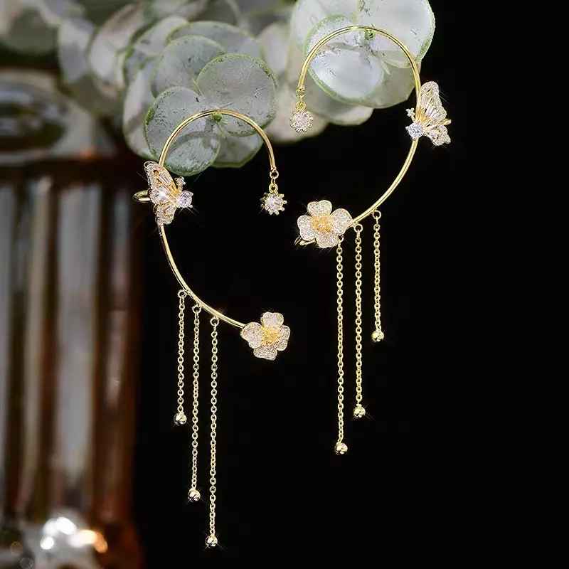 Boucles d'oreilles pendantes papillon à pompon et zircon