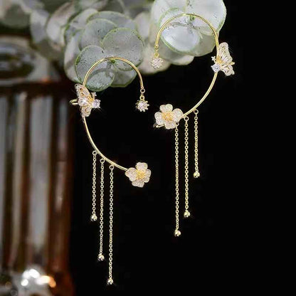 Boucles d'oreilles pendantes papillon à pompon et zircon